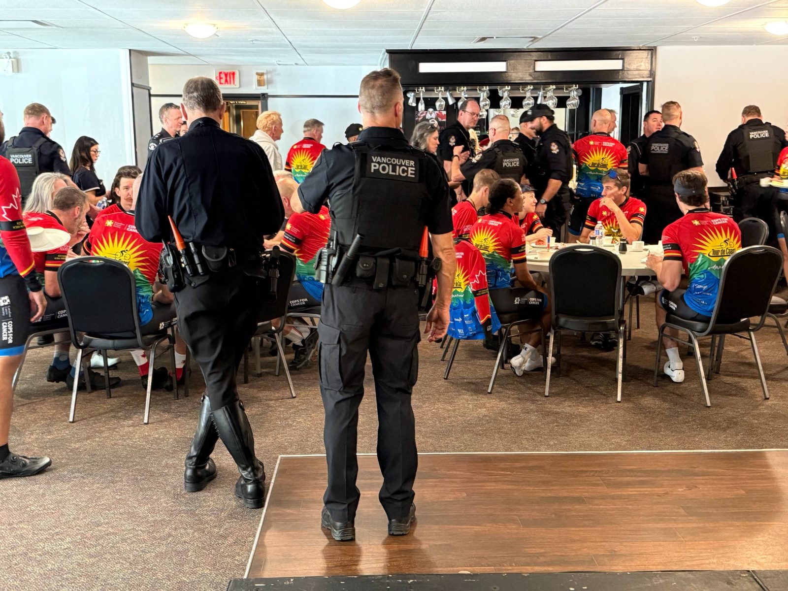 Tour de Coast riders and Vancouver Police officers having lunch at the Eagles Club North Vancouver
