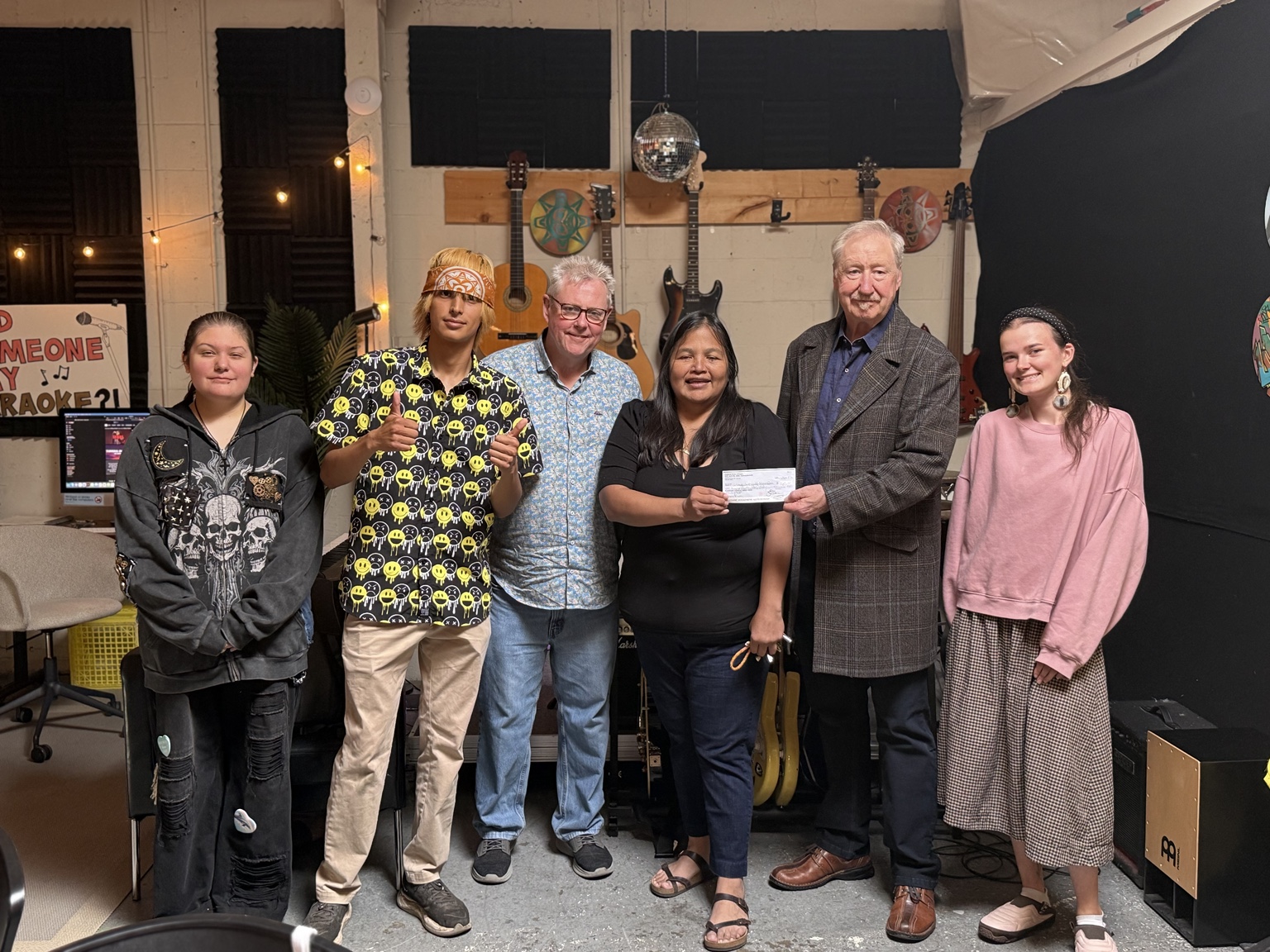 Eagles Club North Vancouver presenting a $1,160 donation to the Urban Native Youth Association